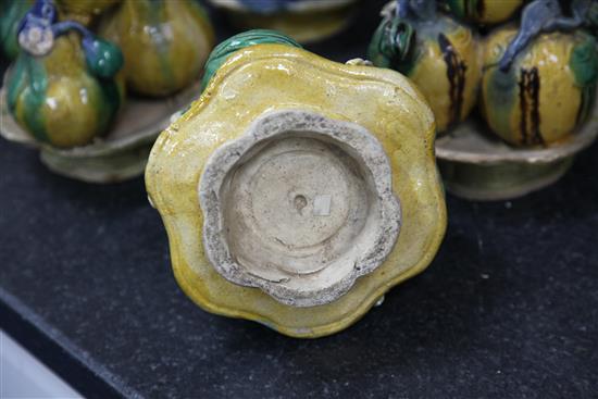 Six Chinese Canton pottery models of stacking fruit in dishes, late 19th century, height 16cm - 18.5cm